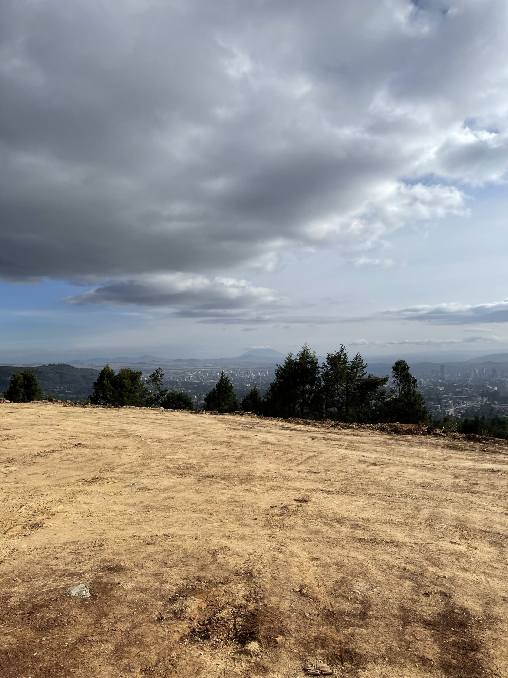 Sky Stretches Above A Barren Dirt Field